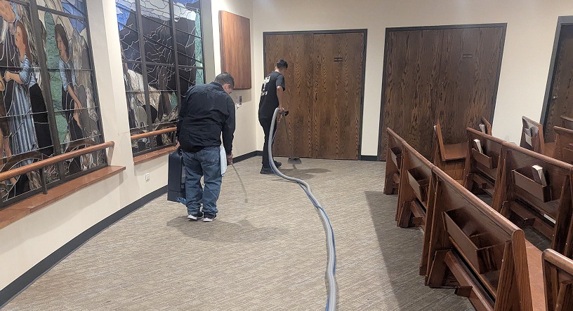Commercial carpet extraction being performed in a church sanctuary as part of a deep cleaning